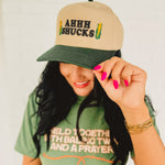Two tone adjustable baseball cap with a cute corn pun that reads "Ahhh Shucks" featuring corn graphics.