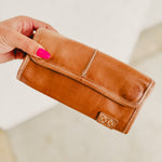 Bedstu Canton leather wallet with magnetic closure, card holders, and zipper compartments.