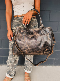 Distressed black Bedstu Rockaway purse made of genuine leather for long use.