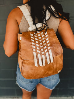 Genuine leather Bedstu backpack purse with hand woven details and adjustable straps.