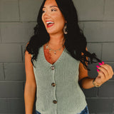 Forest green v-neck knitted sleeveless vest with chunky buttons.