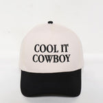 'Cool It Cowboy" embroidered tow toned baseball cap with an adjustable fit.