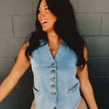 V-neck light wash denim button up sleeveless vest with front pockets.