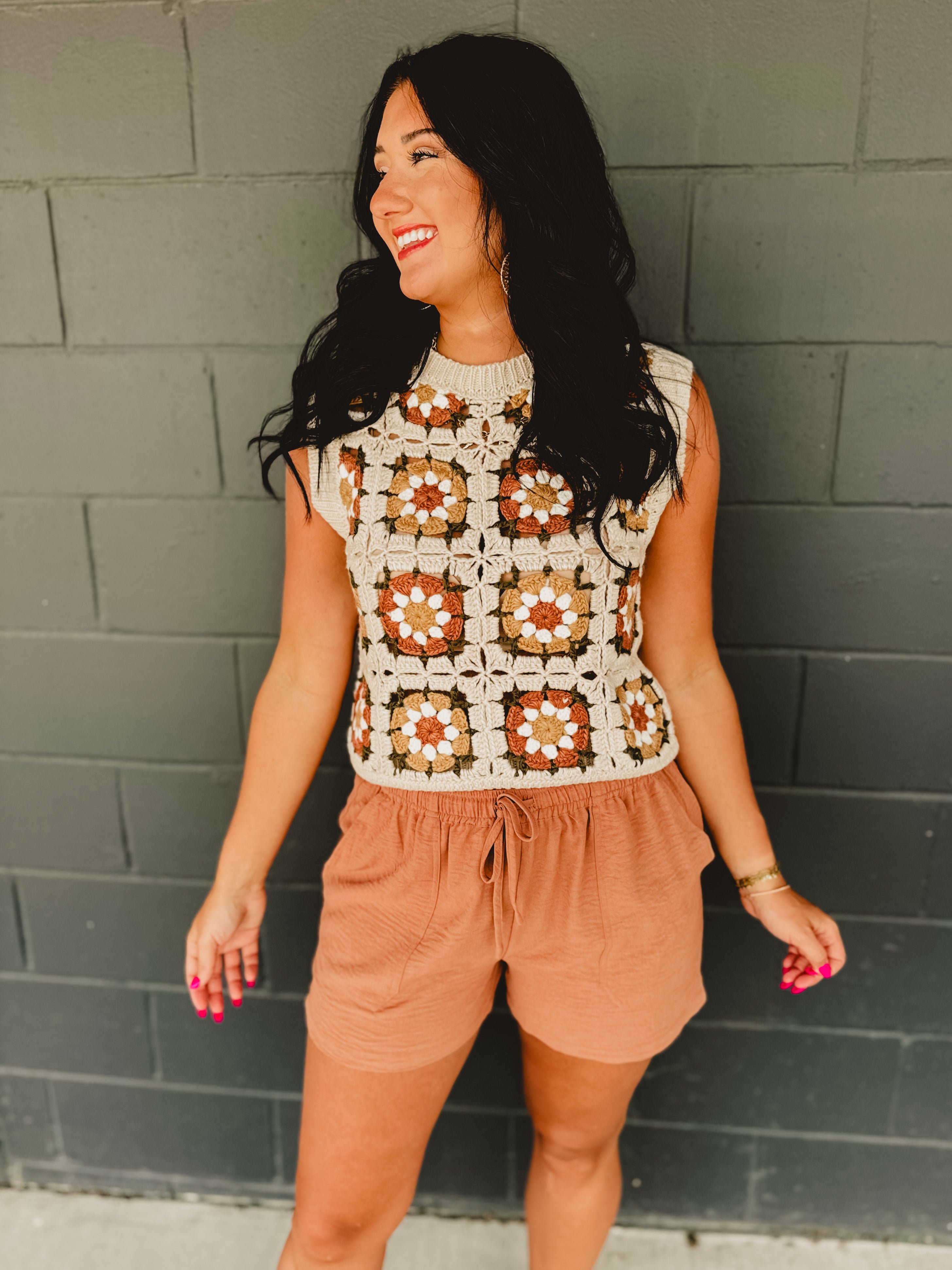Granny square crochet sleeveless vest with a round neck in natural multicolor.