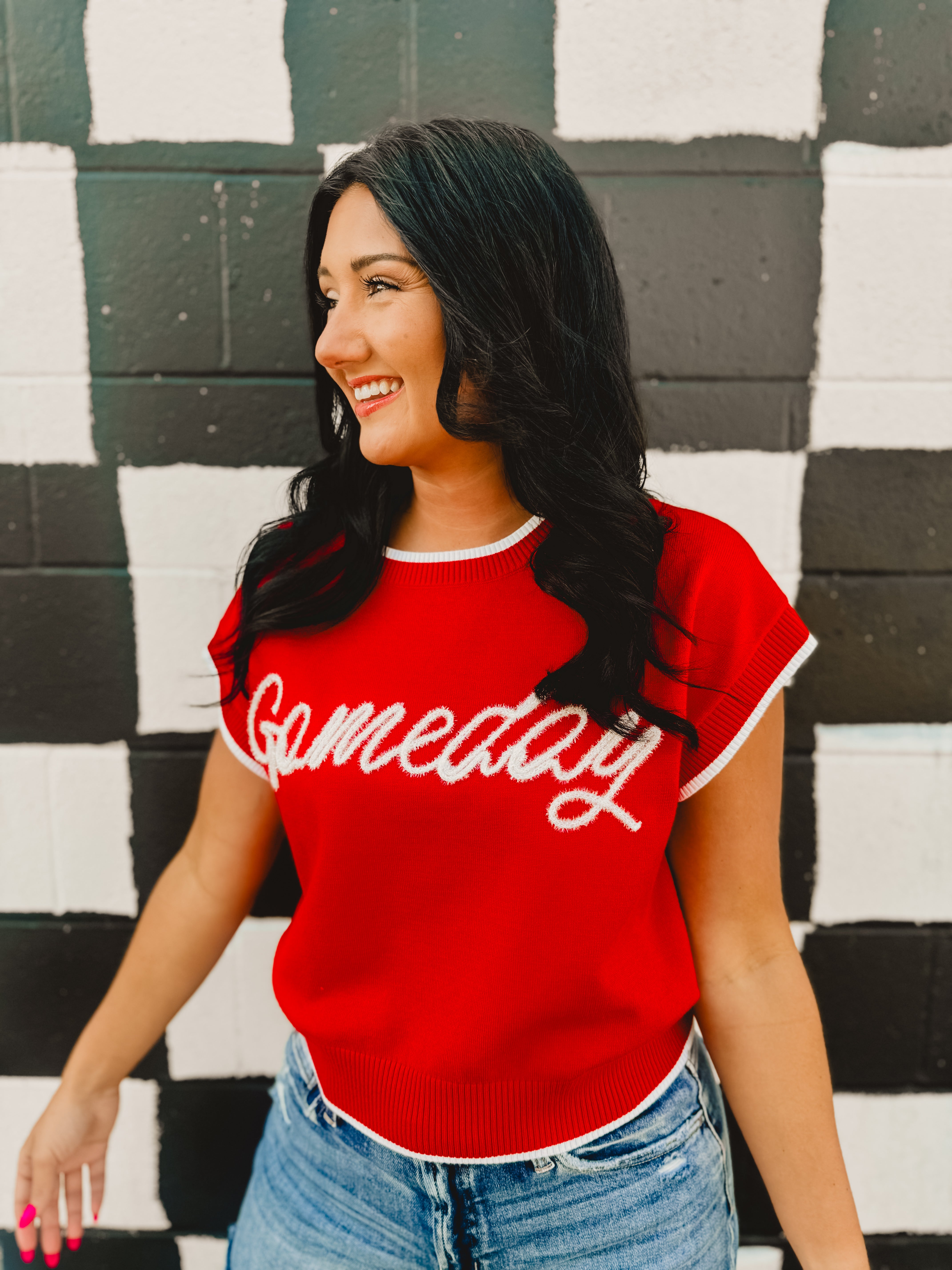 Glitter rope "Gameday" lettering on a red sweater tank with white trim contrast and a round neckline.