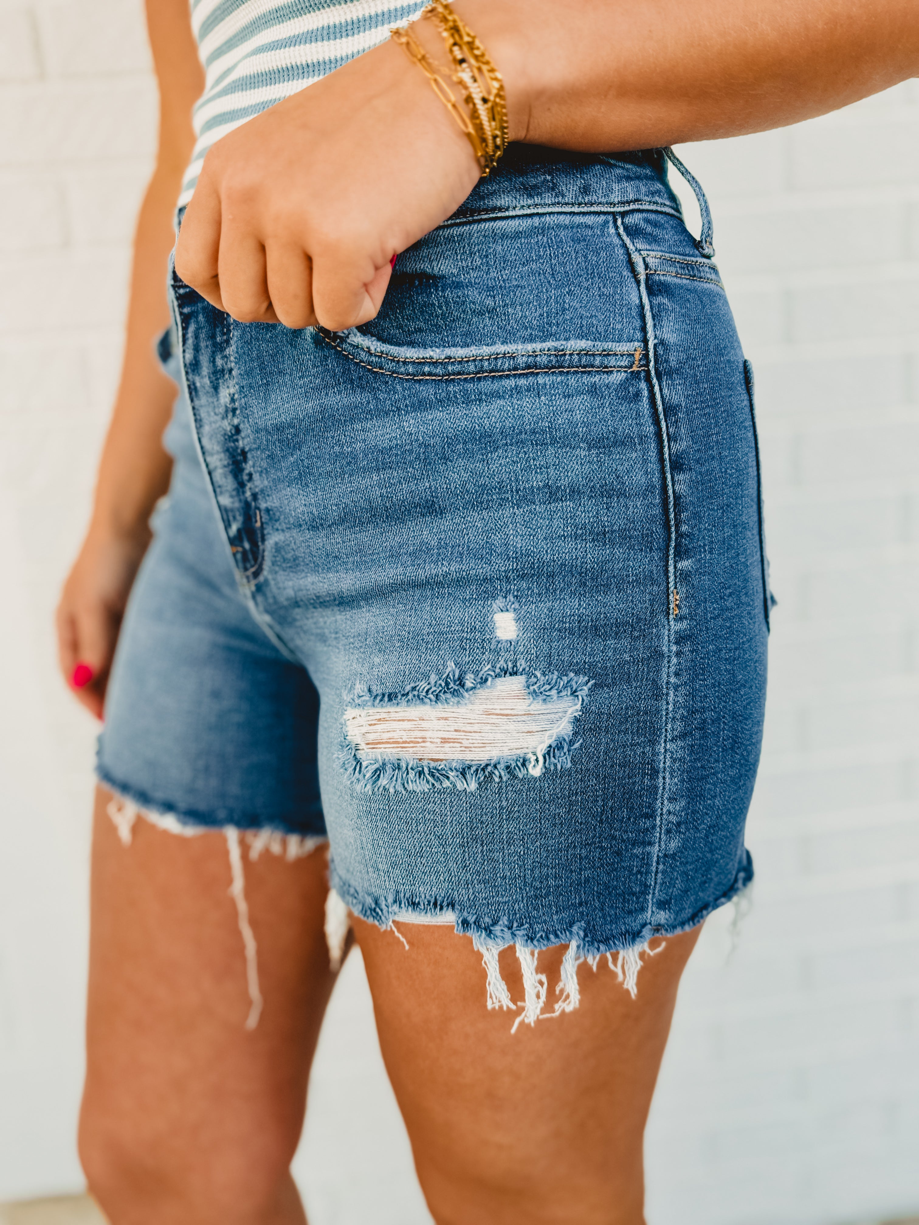 Co-Pilot High Rise Distressed Shorts - Medium Wash - Lace and Grace Boutique