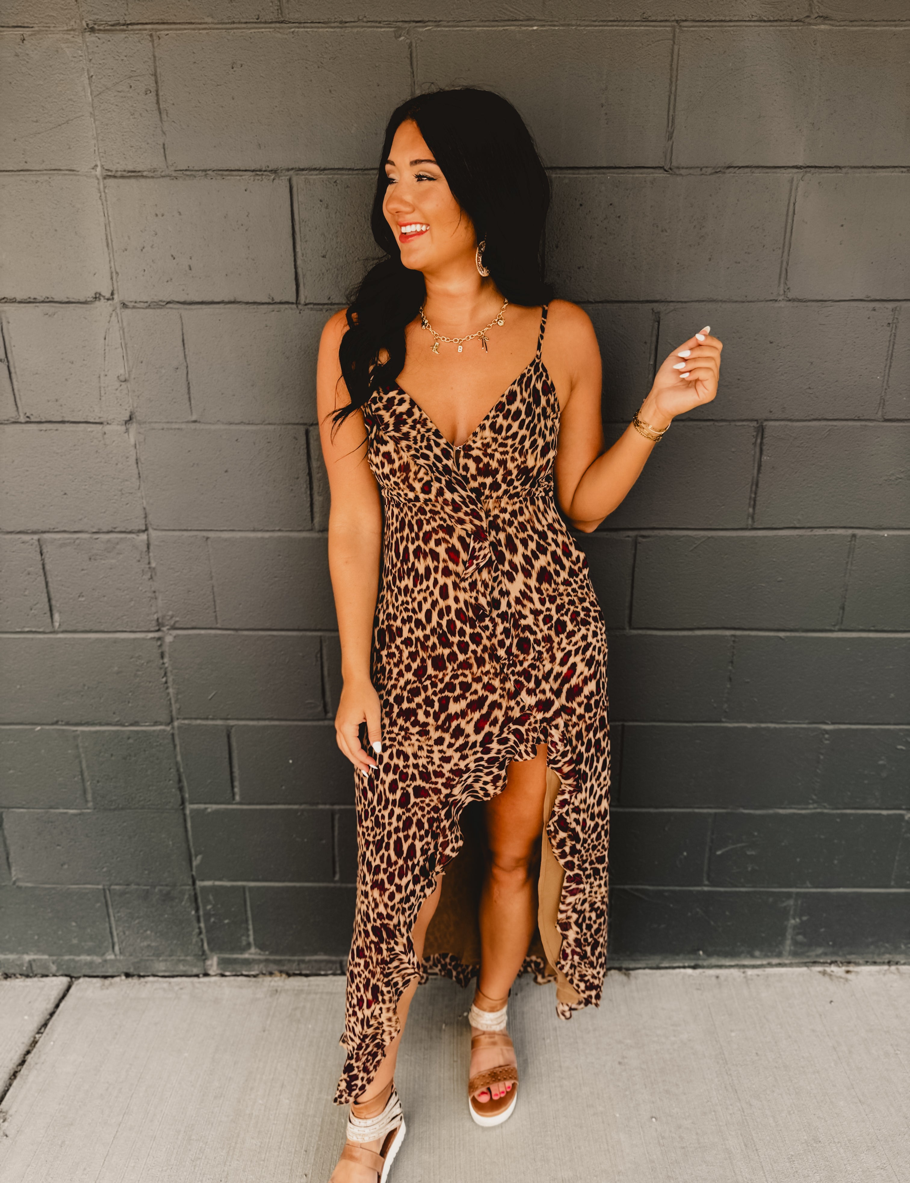 Asymmetrical v-neck leopard ruffle trim spaghetti strap midi length dress.