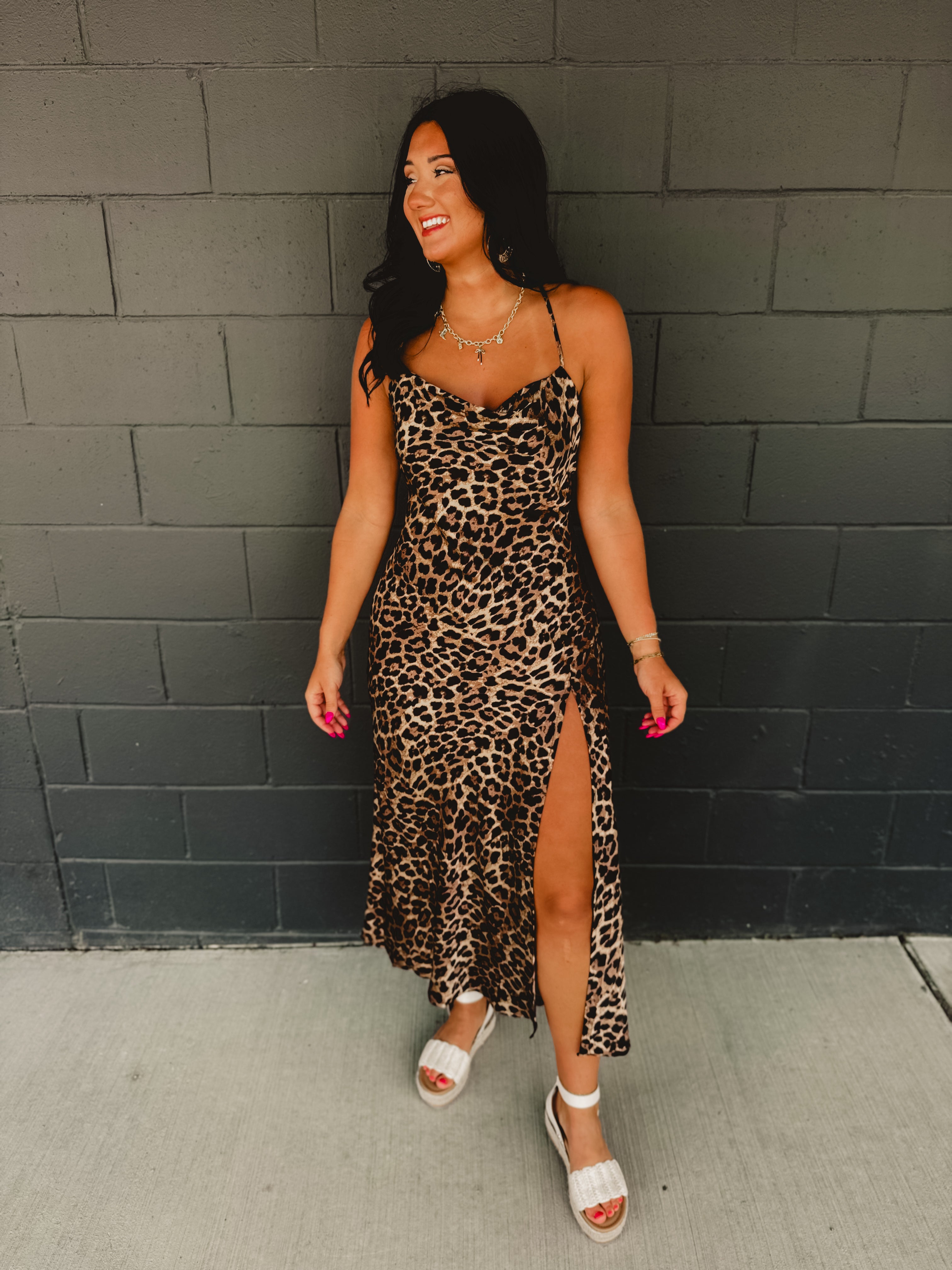 Cowl neckline spaghetti strap satin leopard print maxi dress with high side slit.