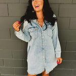 Long sleeve button up light denim mini dress with front pockets and side pockets.