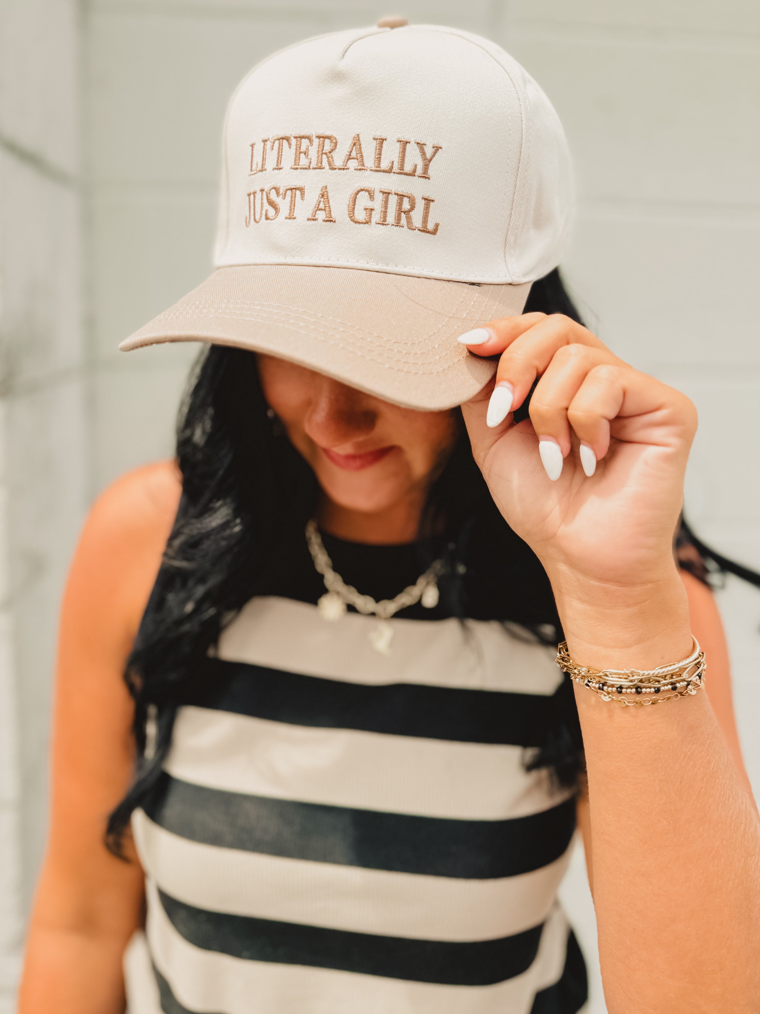 Adjustable two-tone beige/cream baseball cap that reads "Literally Just A Girl."