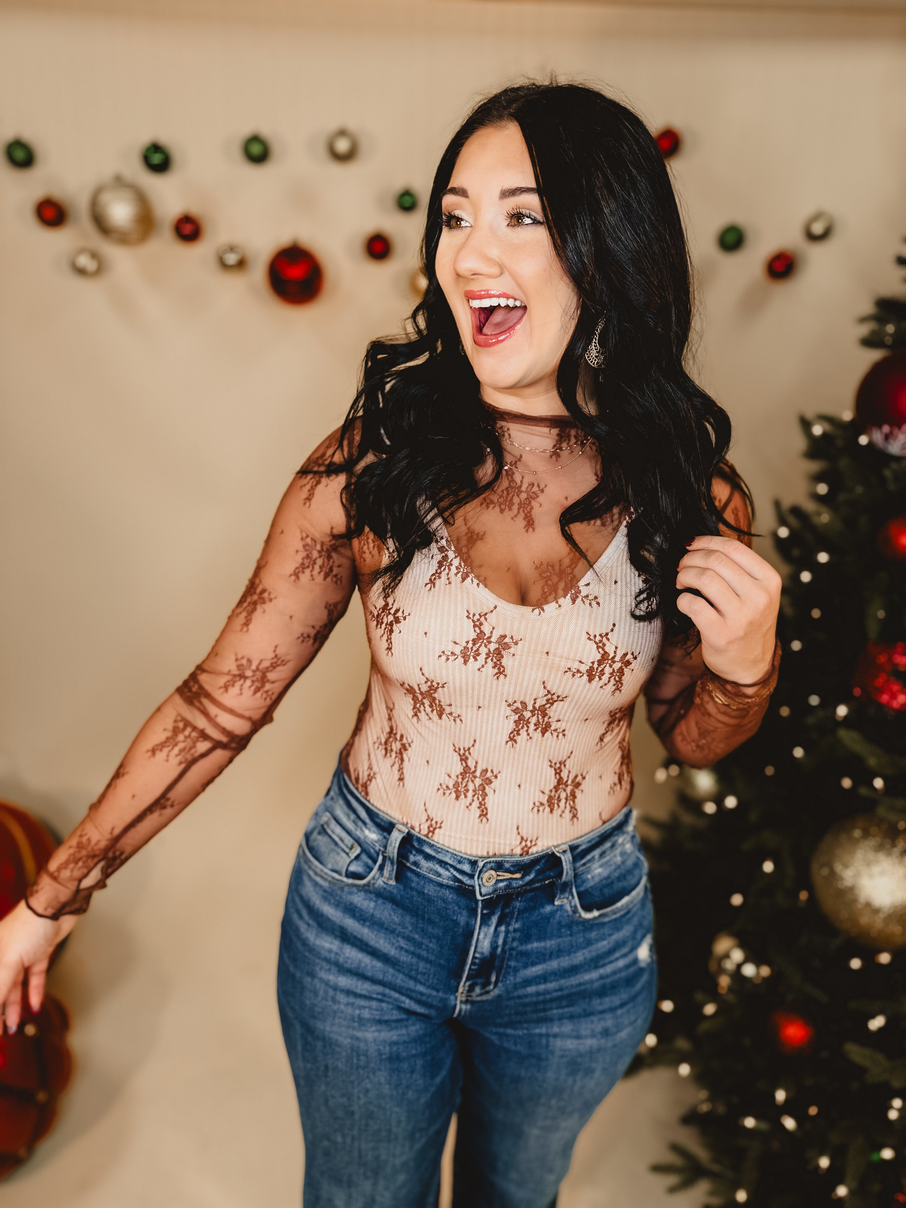 Mesh high neck long sleeve lace top with thumb holes and stretch.