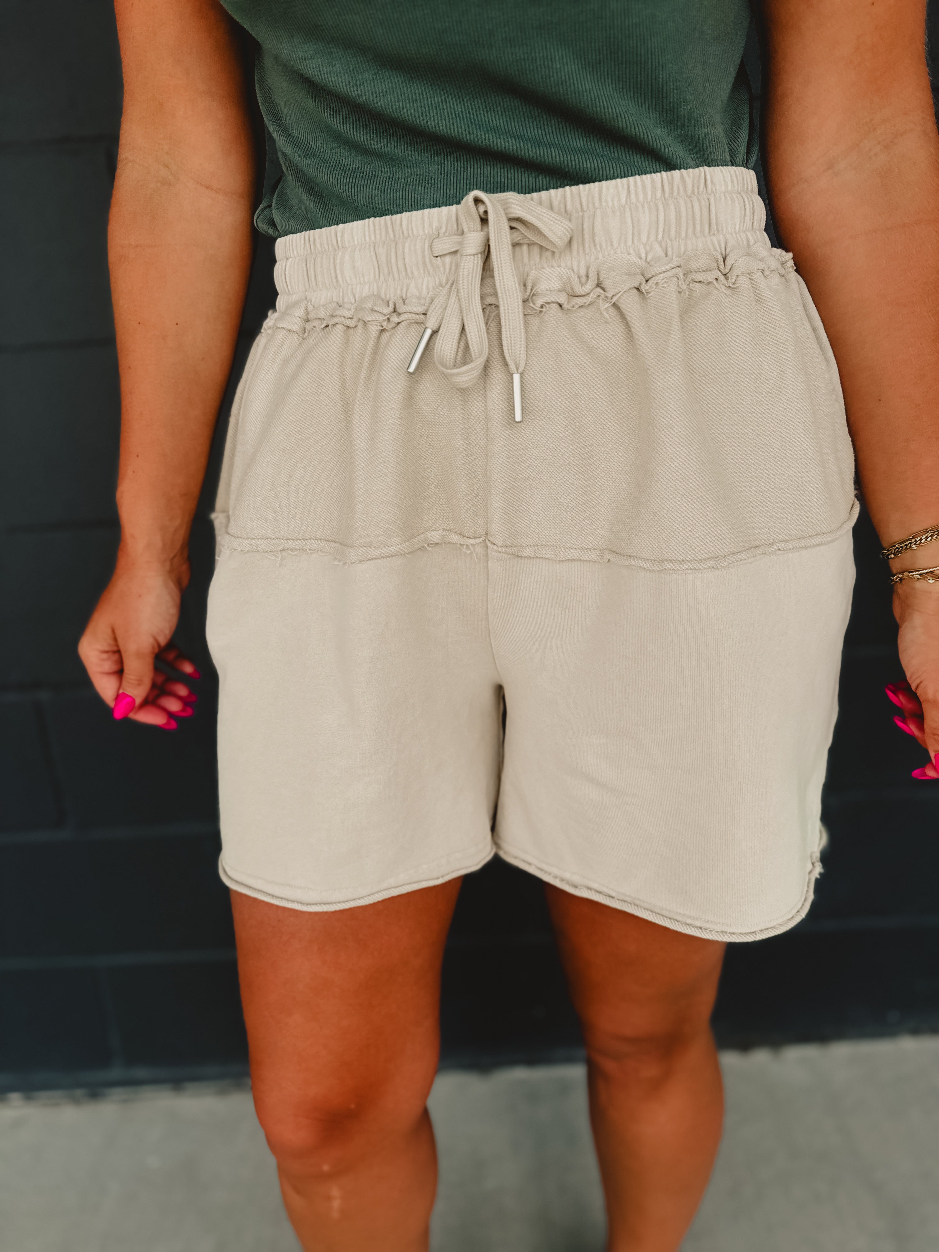 Contrast fabric mineral wash terry knit shorts with an elastic waistband and drawstrings in khaki.