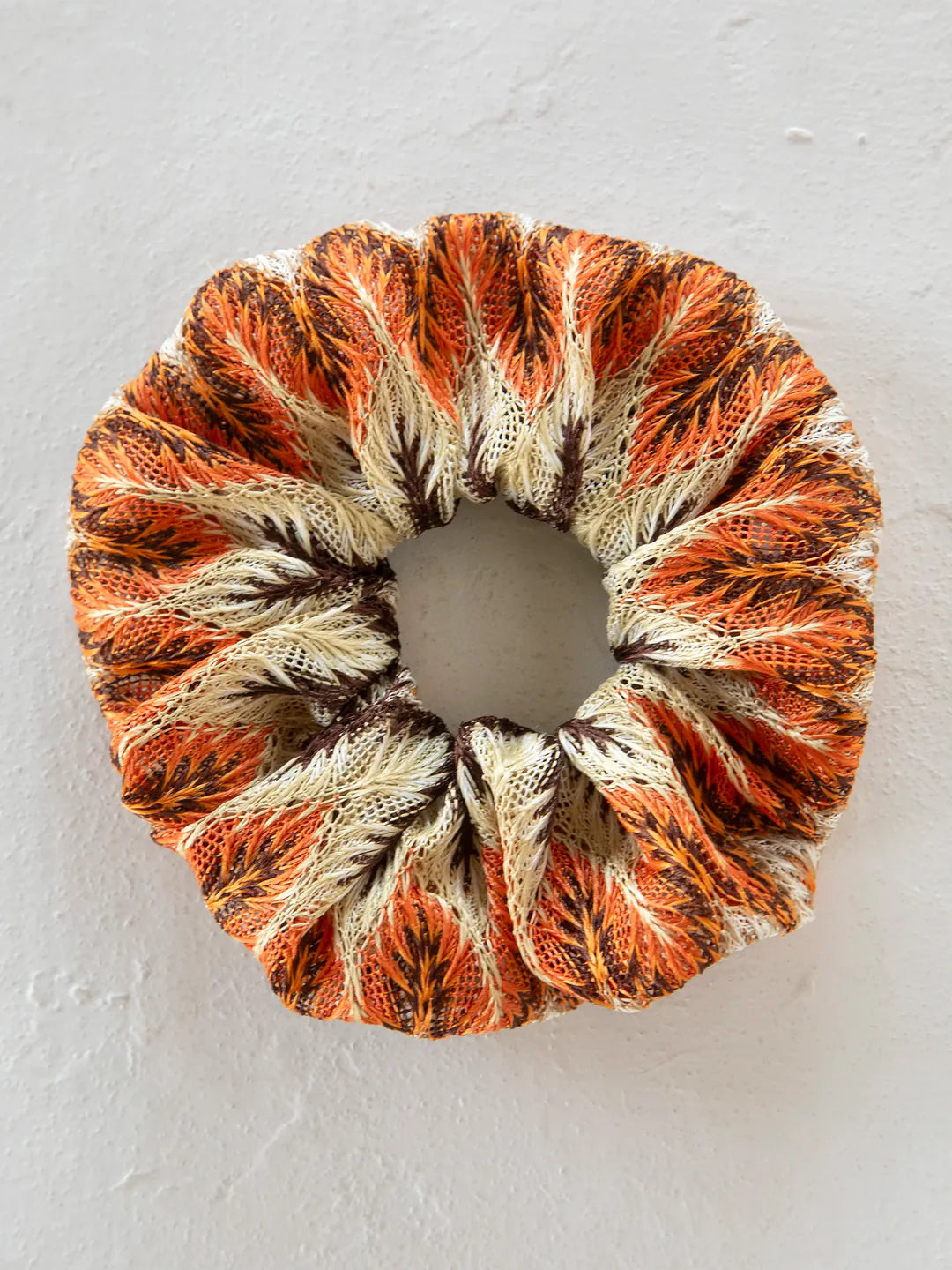 Natural Life burnt orange multi scrunchie ponytail holder.