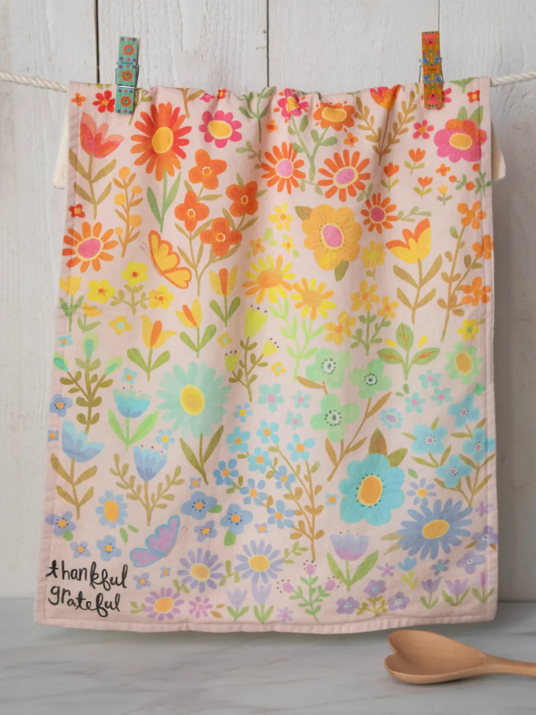 Colorful floral cotton dish towel by Natural Life that reads "thankful, grateful" in the corner.