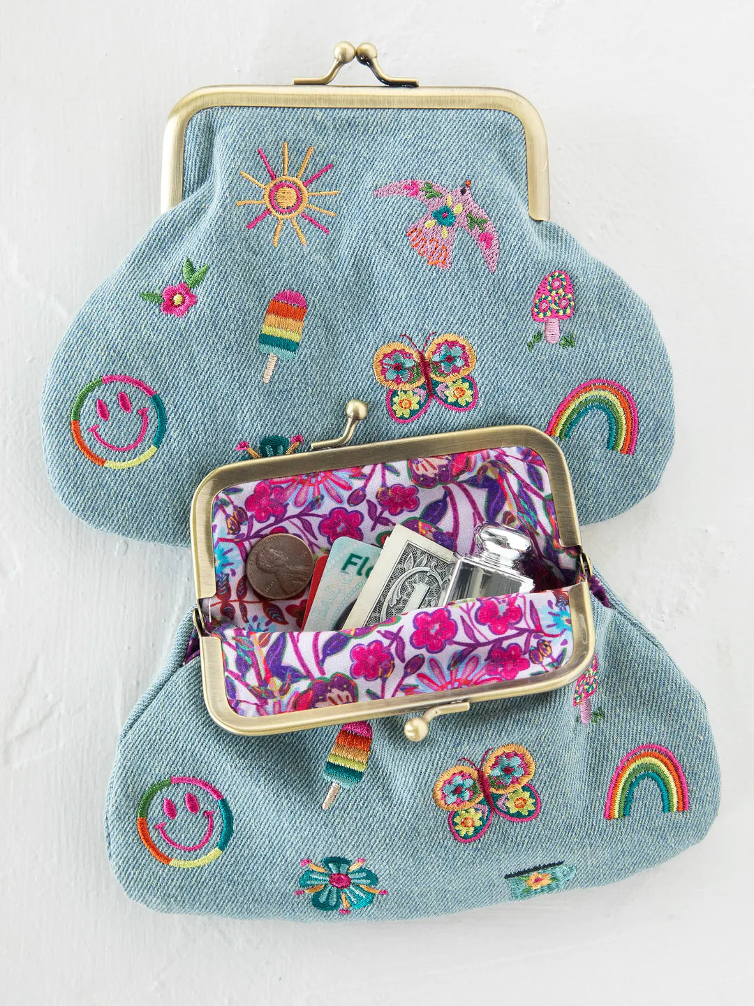 Embroidered kisslock coin purse with graphics by Natural Life in denim.