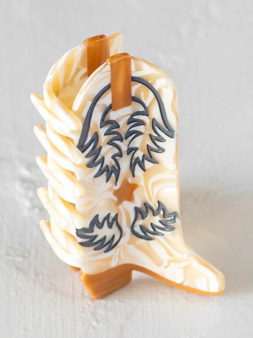 Natural Life boot hair clip in the color cream/tan.