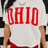 Cropped "Ohio" varsity letter white short sleeved graphic tee with a round neckline.