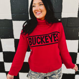 Ohio State licensed rolled turtle neck sweater in red that reads "Buckeyes."
