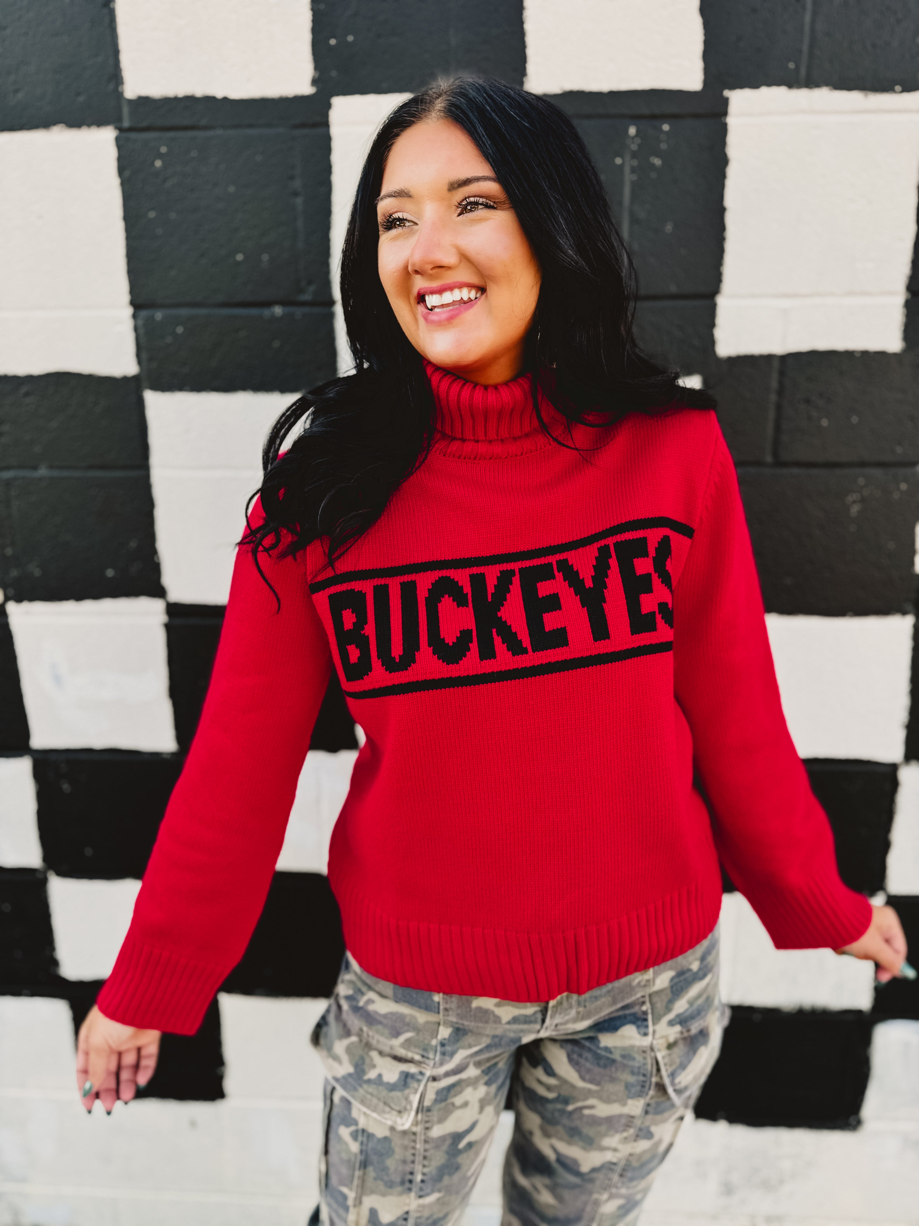Ohio State licensed rolled turtle neck sweater in red that reads "Buckeyes."