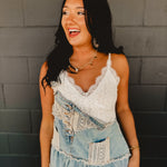 Cropped v-neck sleeveless crochet bodice tank with intricate lace detail.