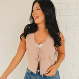 V-neck tie-up pinstripe sleeveless medium length vest in the color brick and ivory.