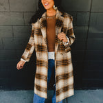 Plaid printed longline duster coat with pockets in the color fawn.
