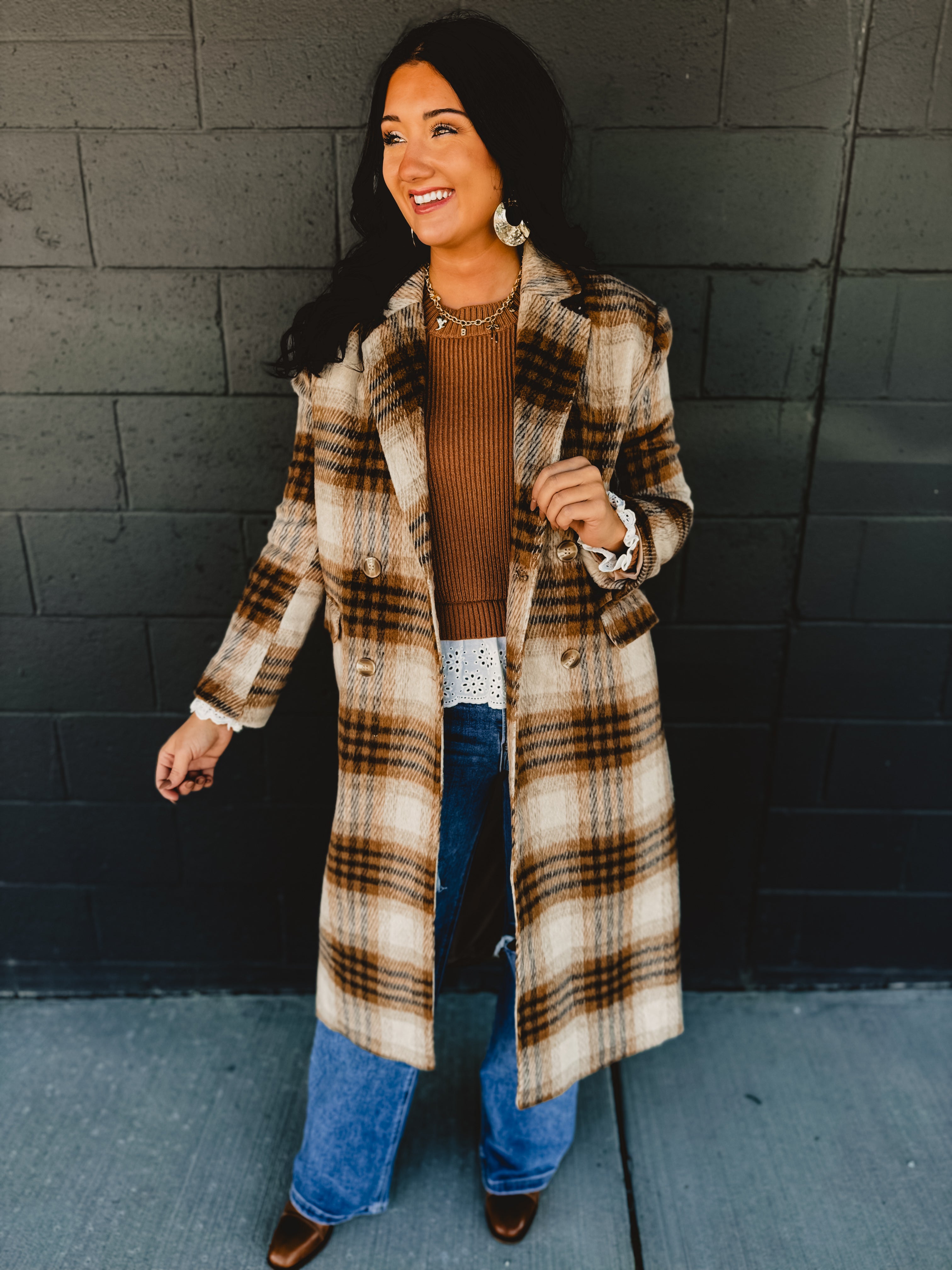 Plaid printed longline duster coat with pockets in the color fawn.