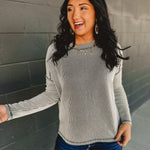 Ribbed material long sleeve top in black/white.