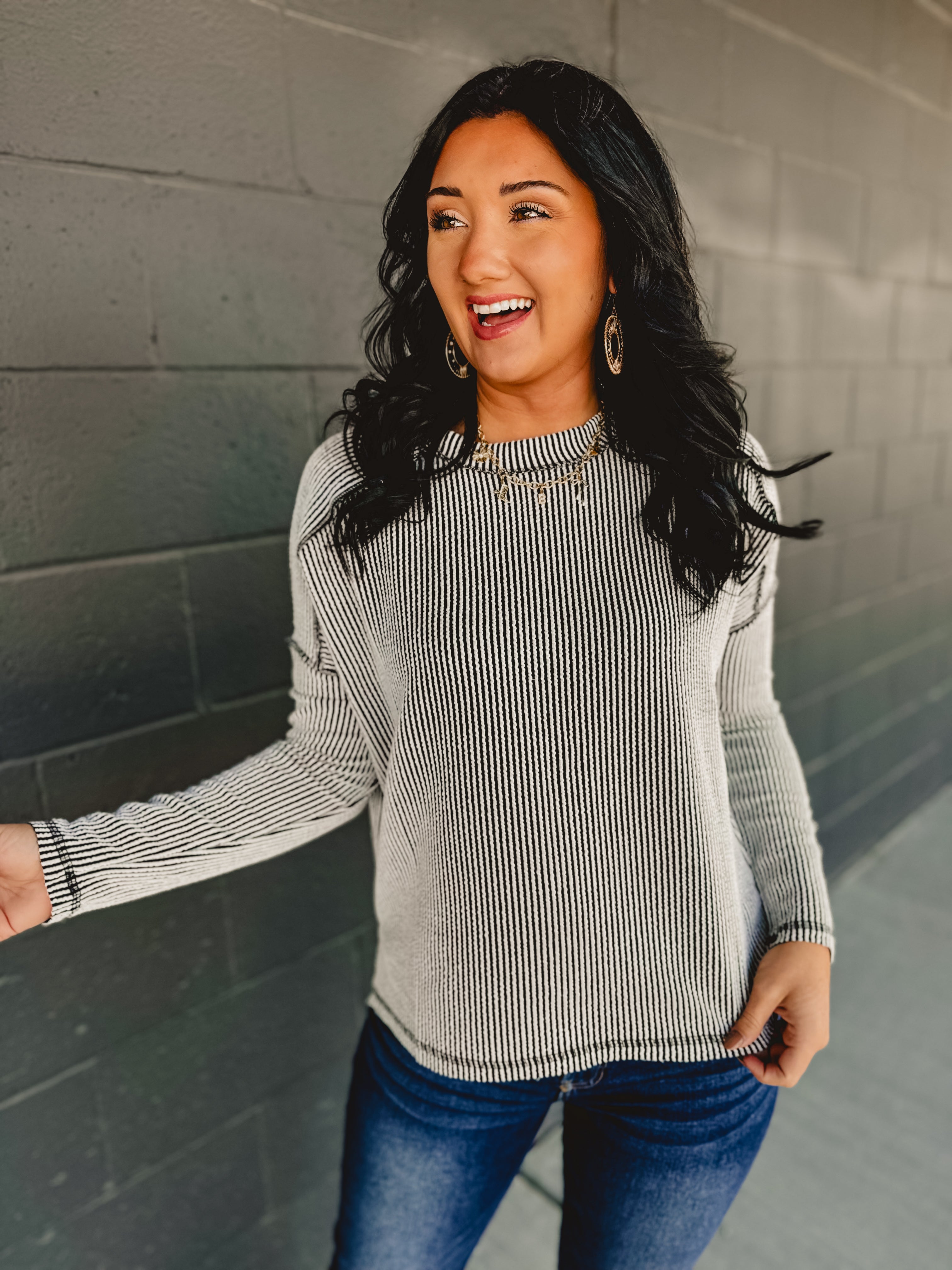 Ribbed material long sleeve top in black/white.