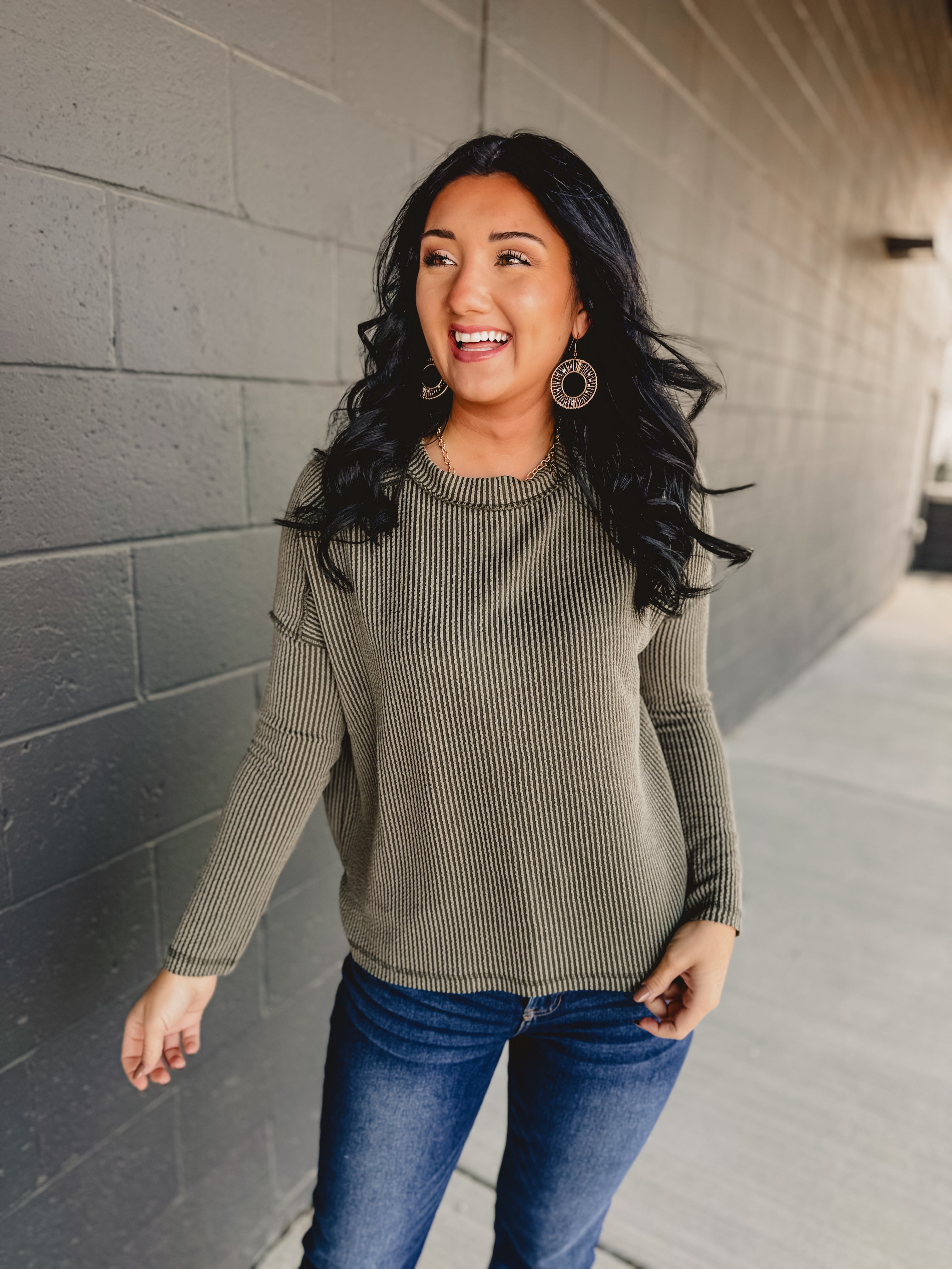 Ribbed exposed seam long sleeve top in dark olive.