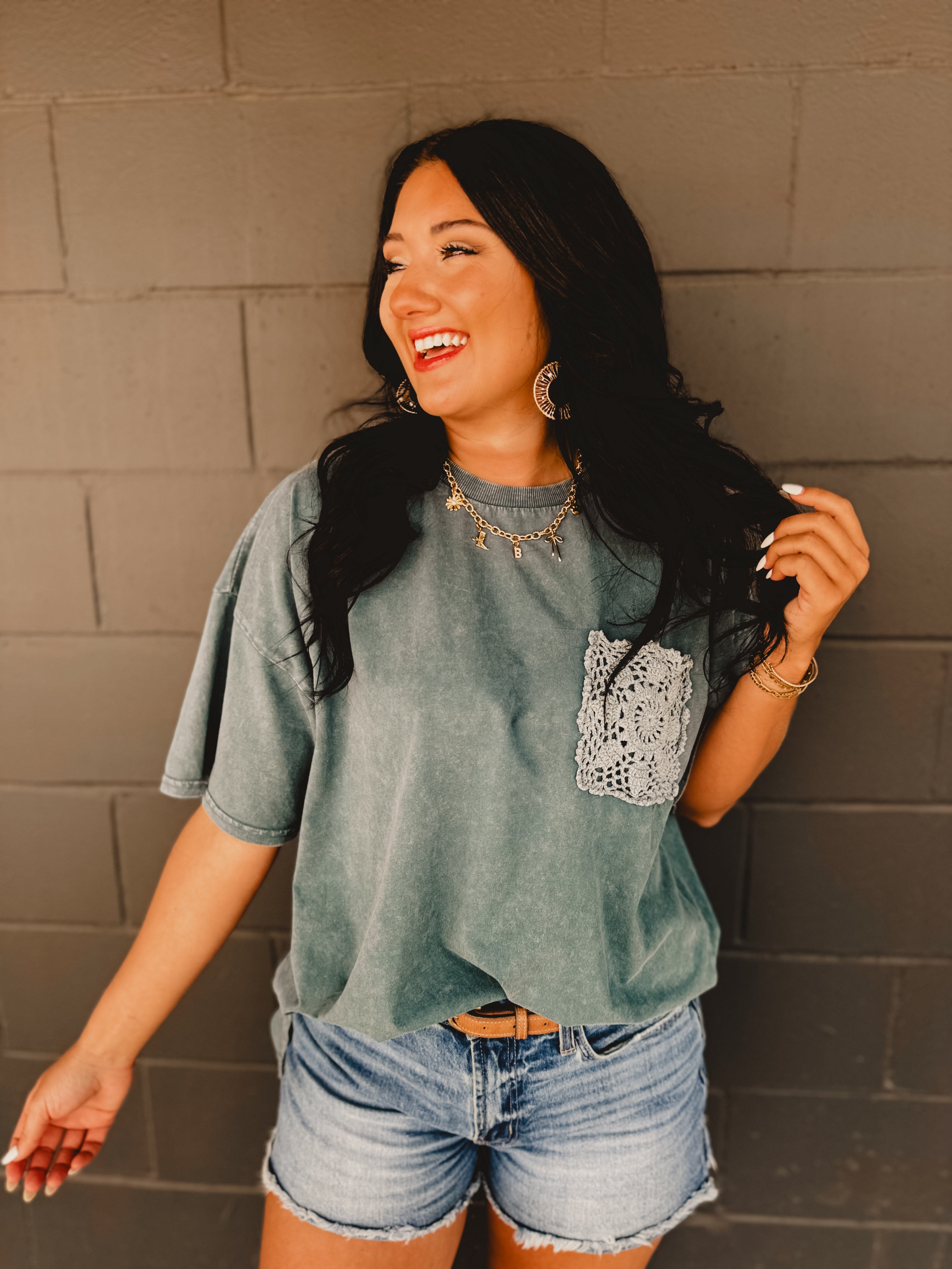 Oversized mineral wash drop shoulder short-sleeved boxy silhouette tee with crochet pocket in the color faded teal.
