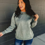 Acid washed long sleeve crew neckline sweatshirt in ash jade.