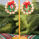 Beaded pearl detail wreath drop earrings.