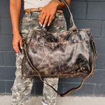 Distressed black Bedstu Rockaway purse made of genuine leather for long use.
