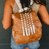 Genuine leather Bedstu backpack purse with hand woven details and adjustable straps.