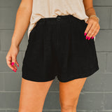 Dress up or down with the pleated linen blend zip-up Bermuda shorts with button detail. 