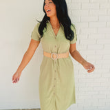 Olive green button down midi dress with v-neck, rolled short sleeves, and  belt fro the waist.