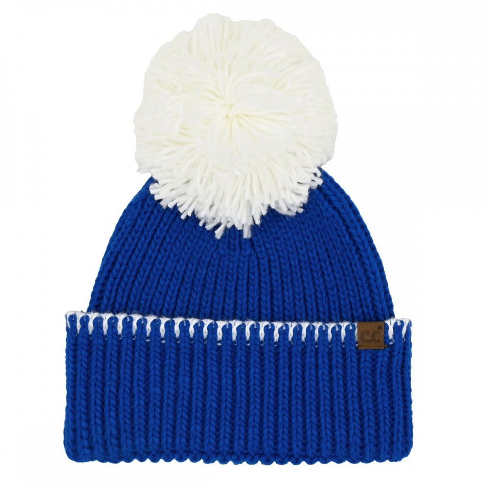 Blue and white beanie with pom.