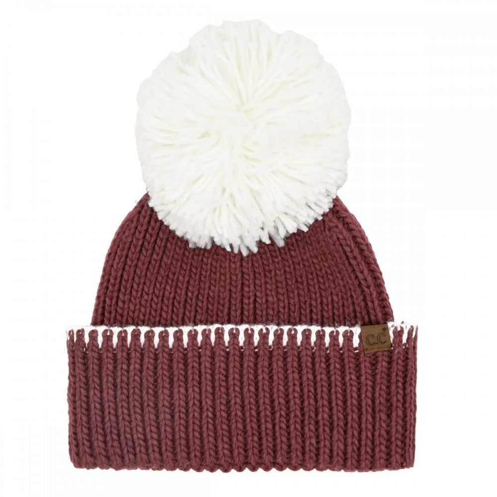 Maroon and white pom beanie.
