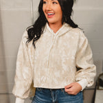 Camo cropped hooded top with drawstrings and oversized sleeves.