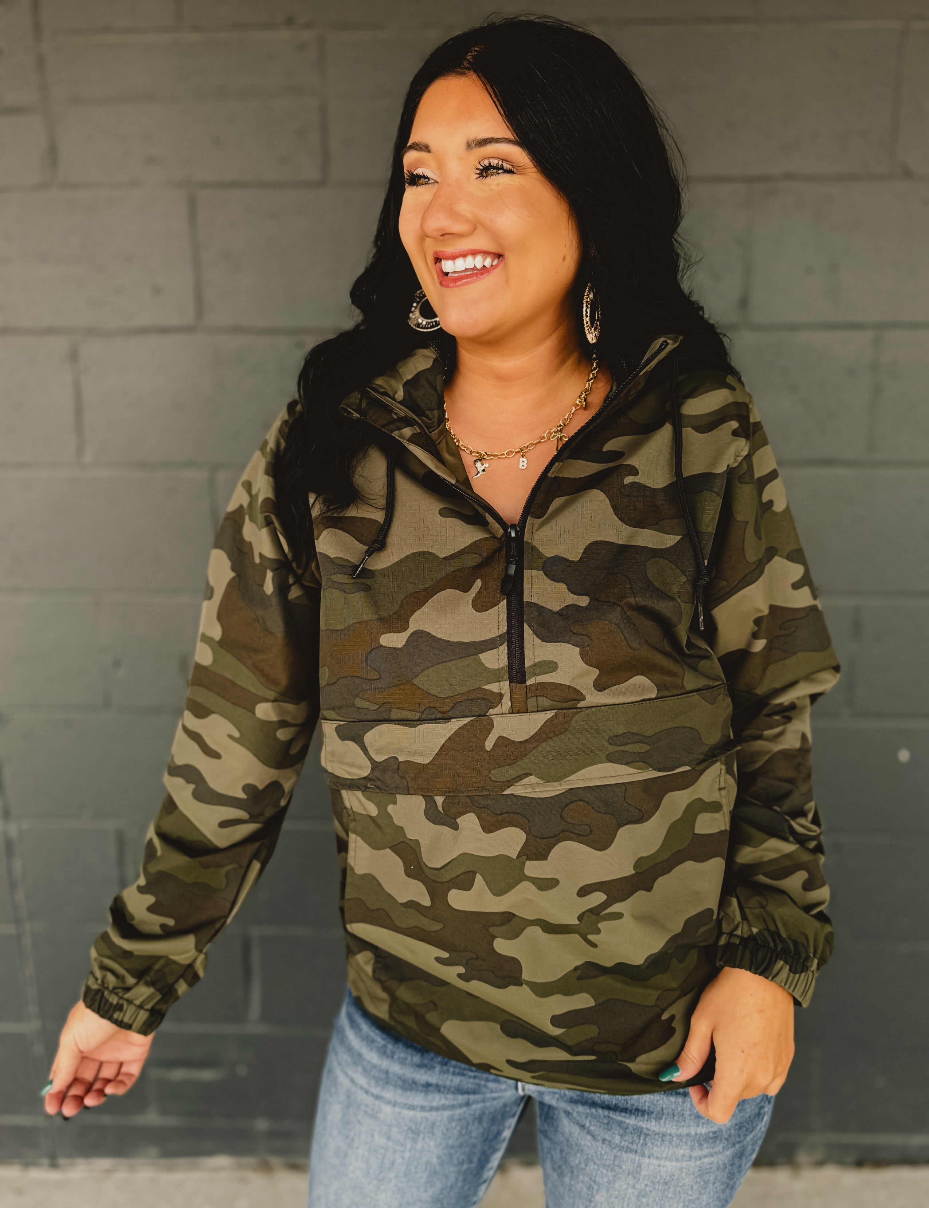 Camouflage quarter zip hooded windbreaker.