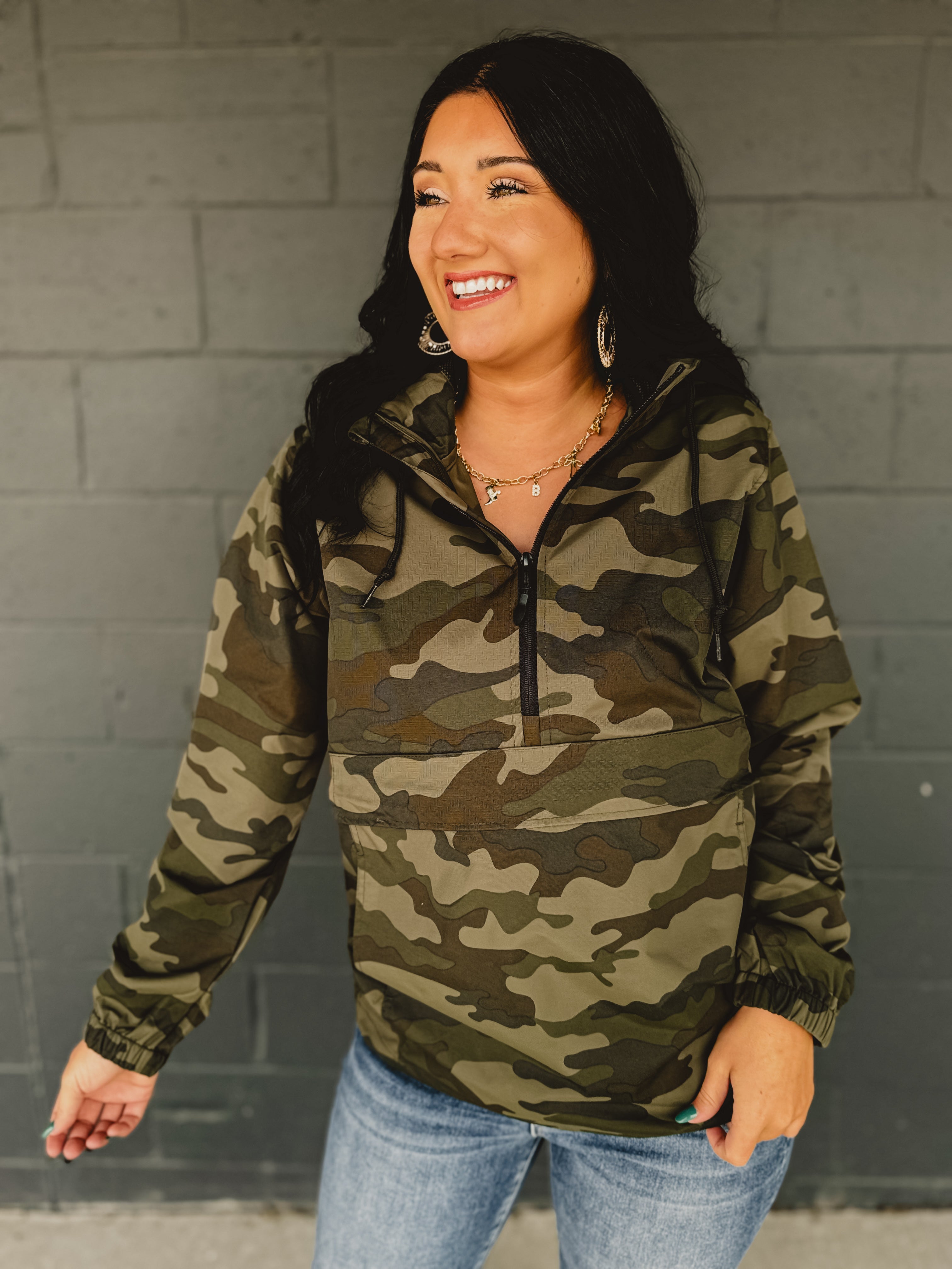Camouflage quarter zip hooded windbreaker.