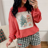 Christmas nutcracker and tree corduroy patch with lace detail sweatshirt in dark coral.