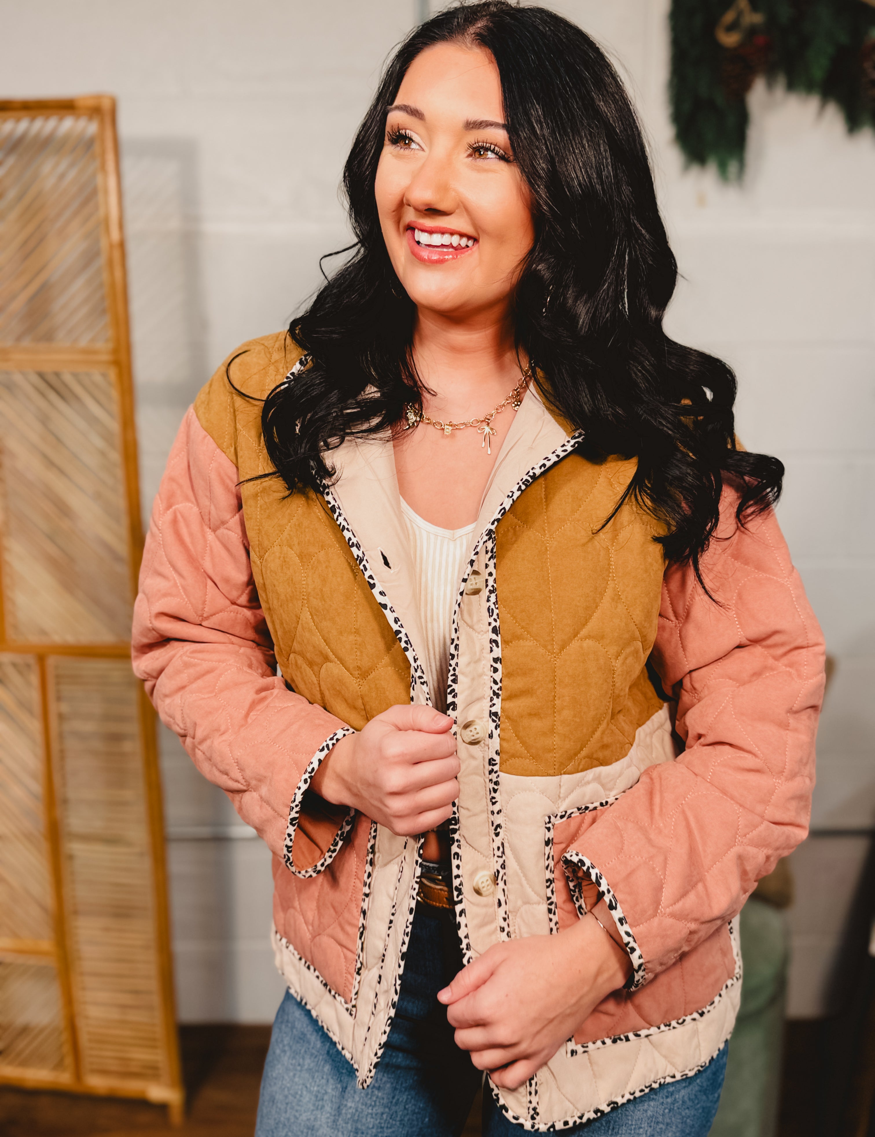 Color block quilted button down jacket with front pockets and contrast trim.