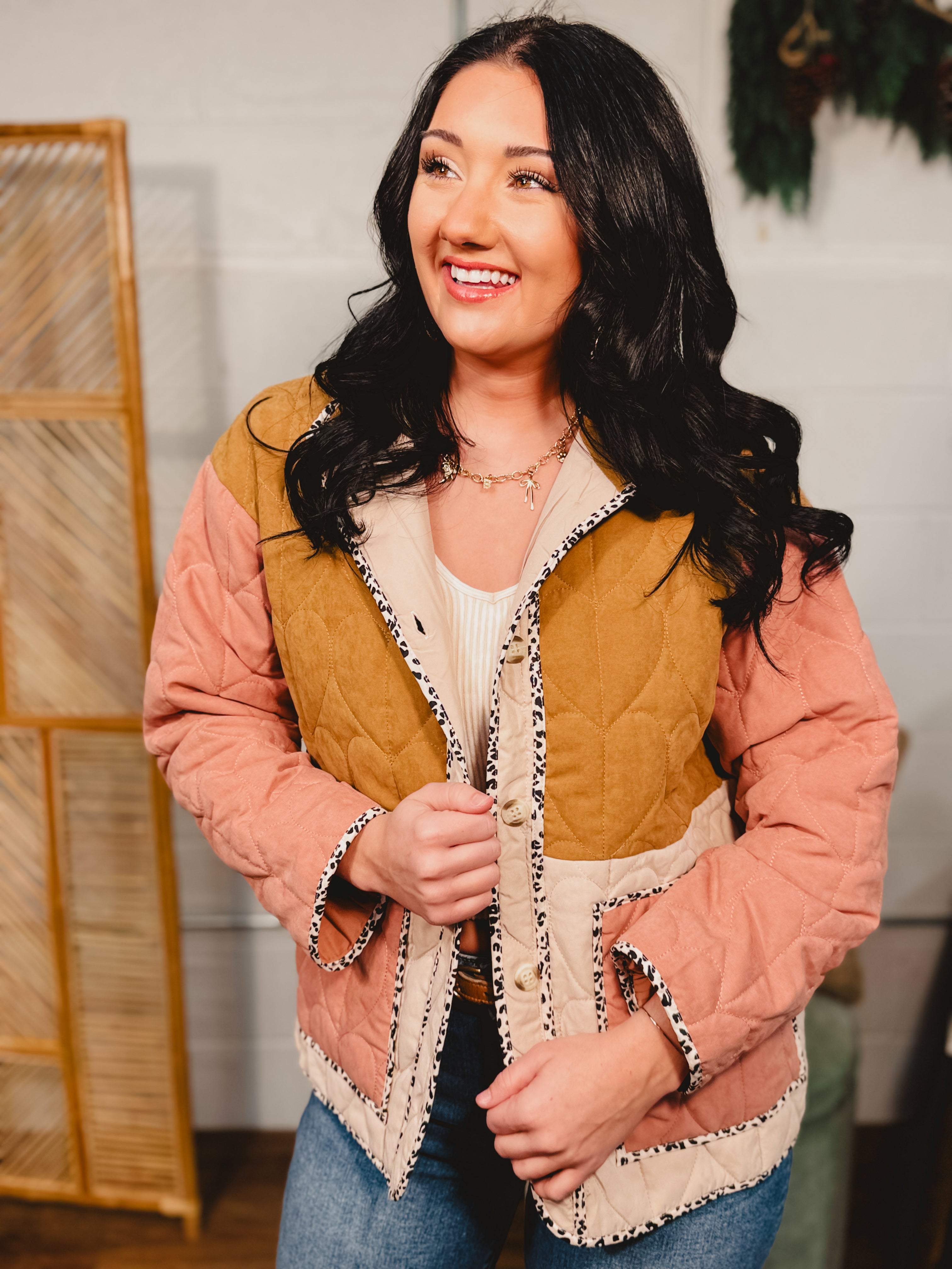 Color block quilted button down jacket with front pockets and contrast trim.