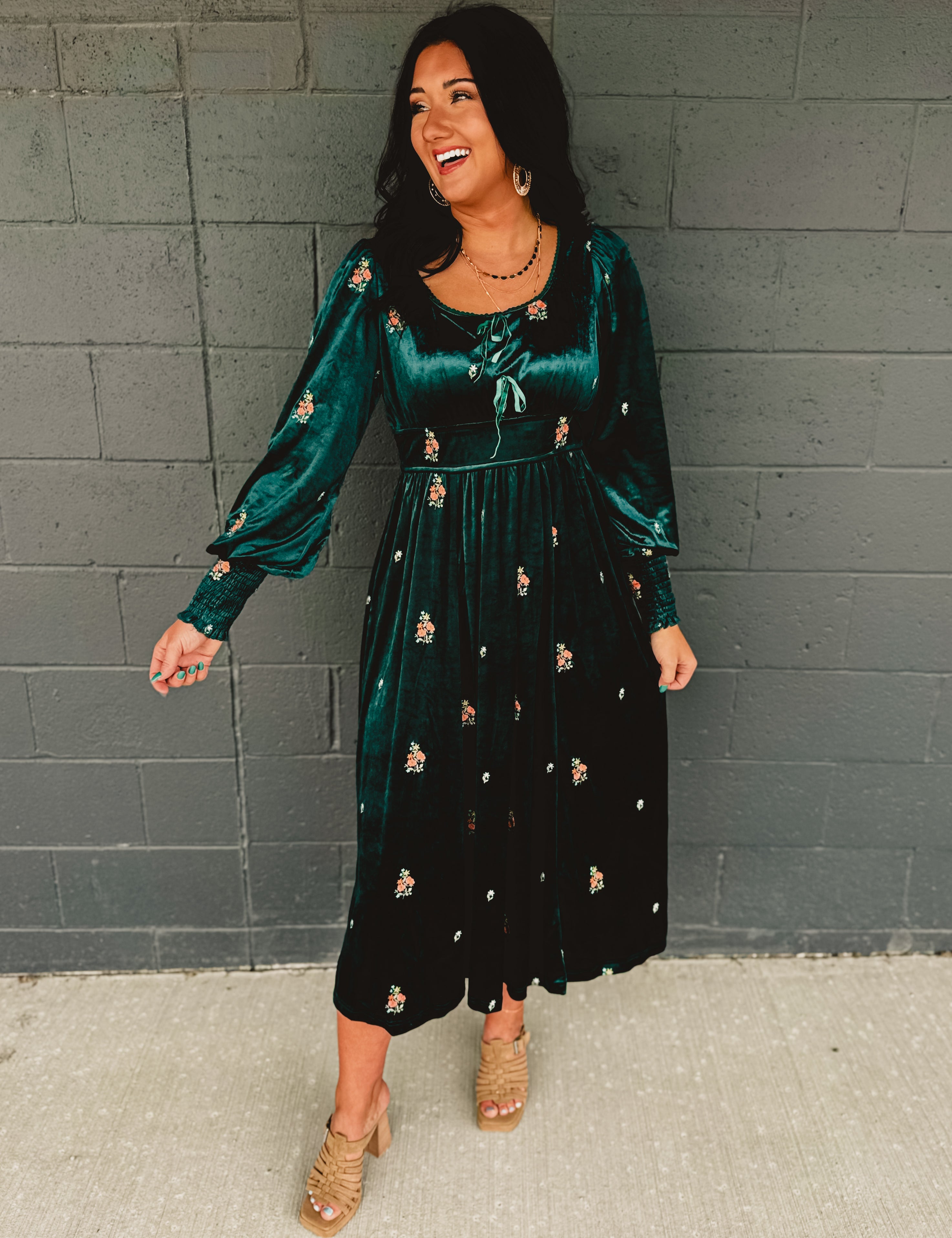 Dark green velvet floral embroidered maxi dress with front bows and smocked sleeve ends.