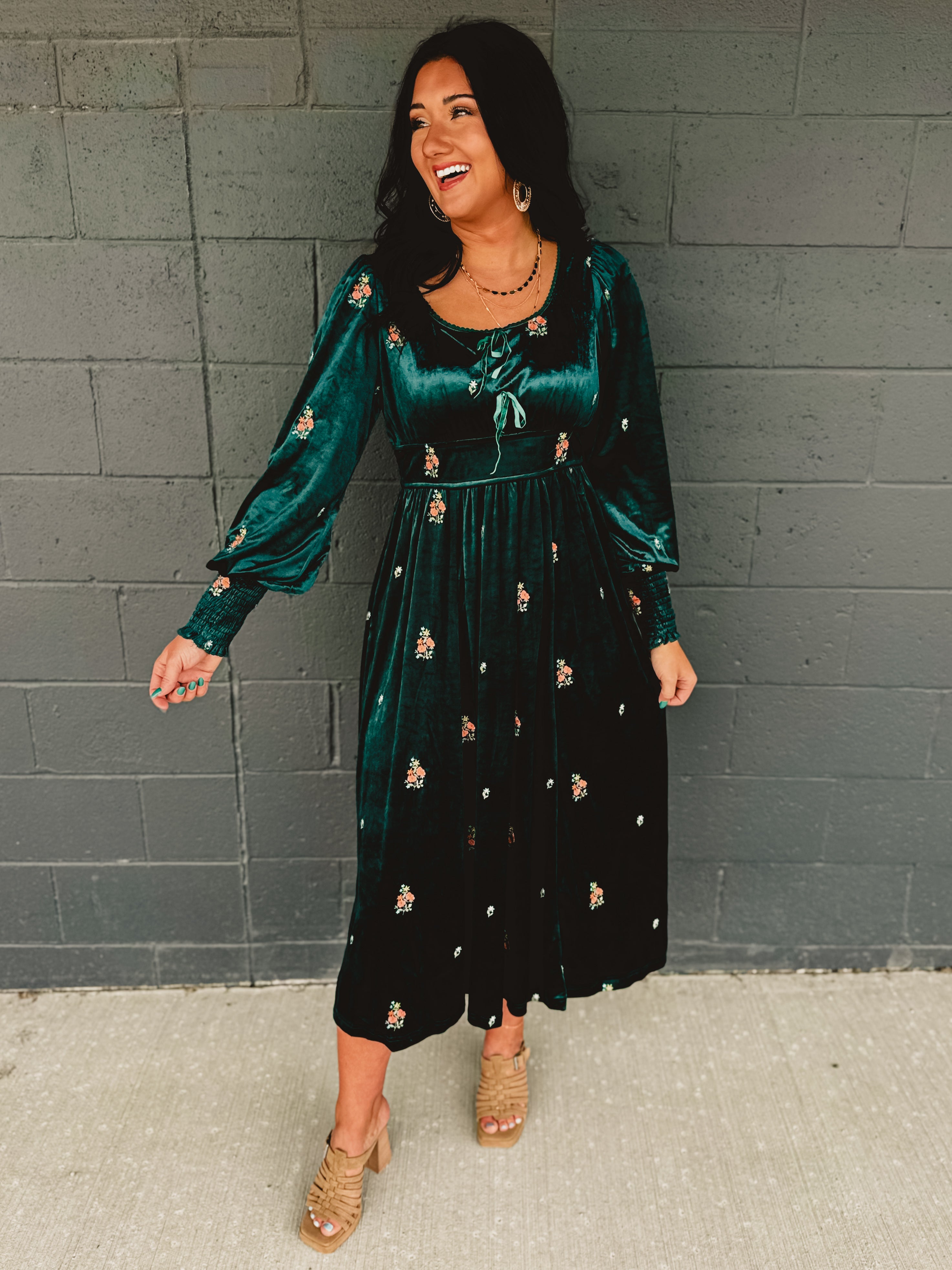 Dark green velvet floral embroidered maxi dress with front bows and smocked sleeve ends.