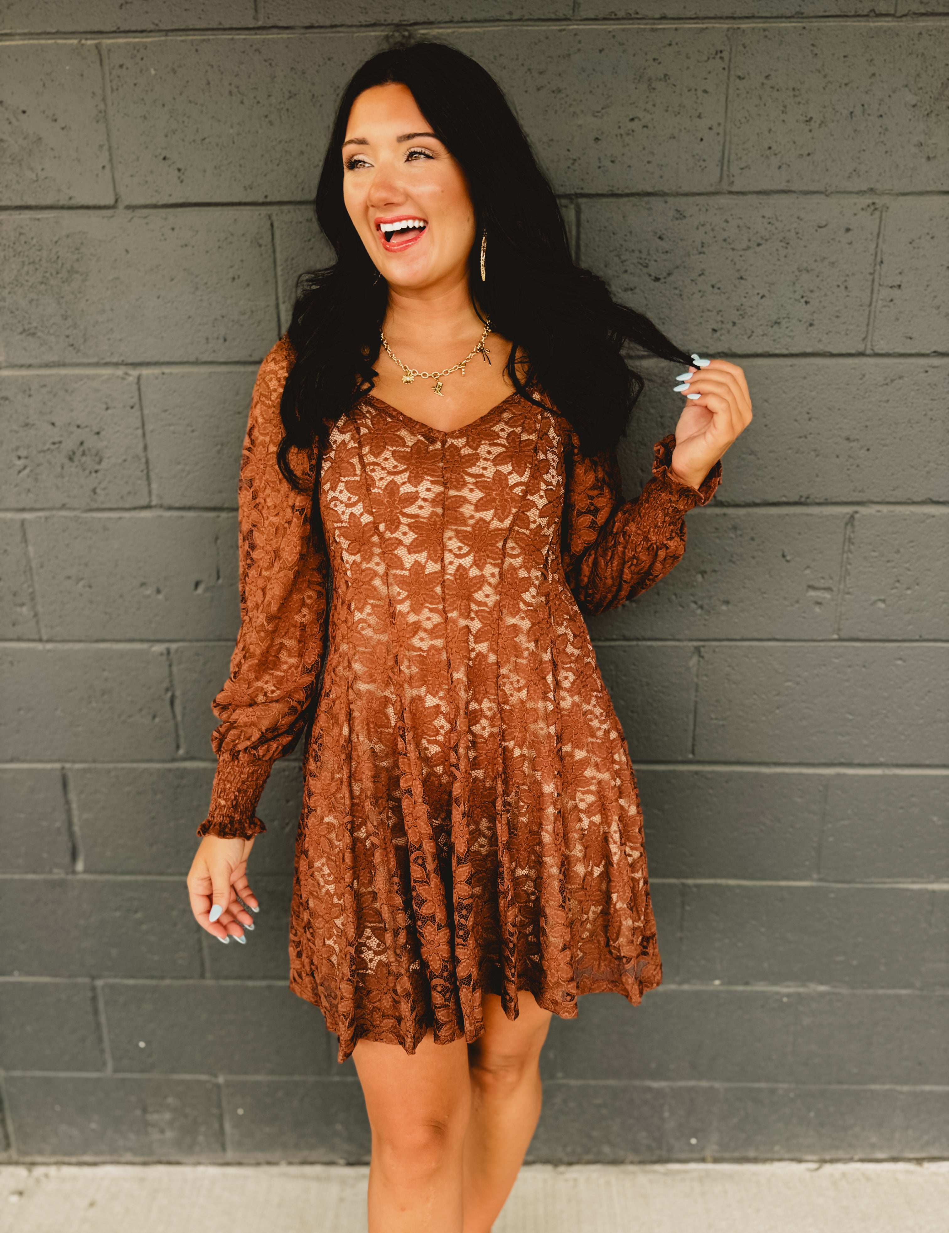 Sweetheart neckline fit and flare mini dress with hidden zipper, elastic sleeves, and partial smocked back bodice in chocolate.