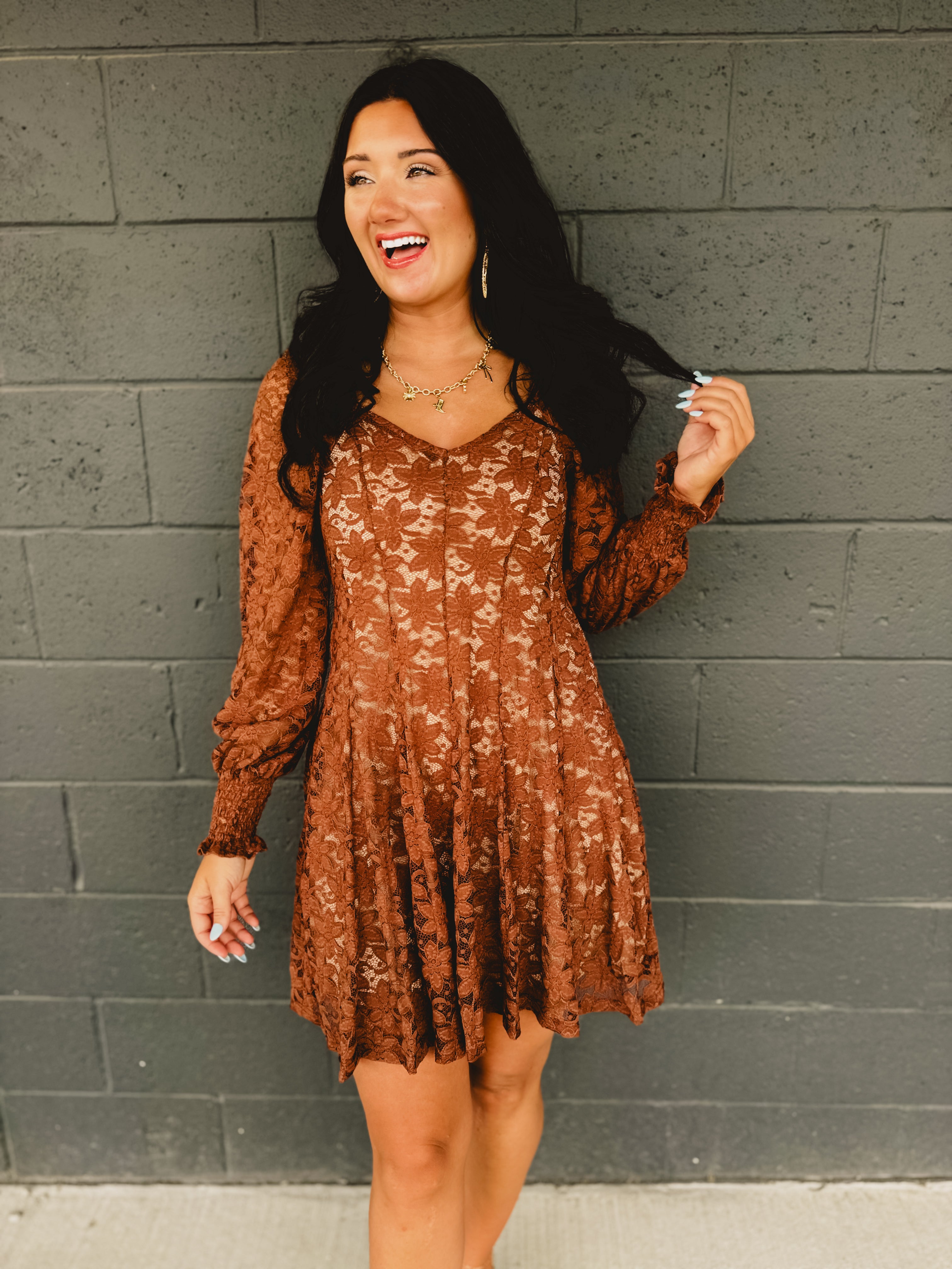 Sweetheart neckline fit and flare mini dress with hidden zipper, elastic sleeves, and partial smocked back bodice in chocolate.