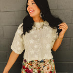 Lace floral embroidered sheer short sleeved drop shoulder top in cream.
